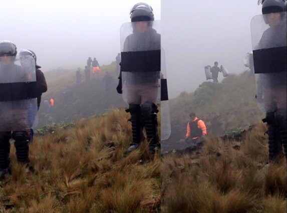 Peruvian National Police acting as private security for Yanacocha with “Police” signs covered in black tape. In the background workers destroying crops and stealing bags of potatoes. Source: solidaritecajamarca.blogspot.fr